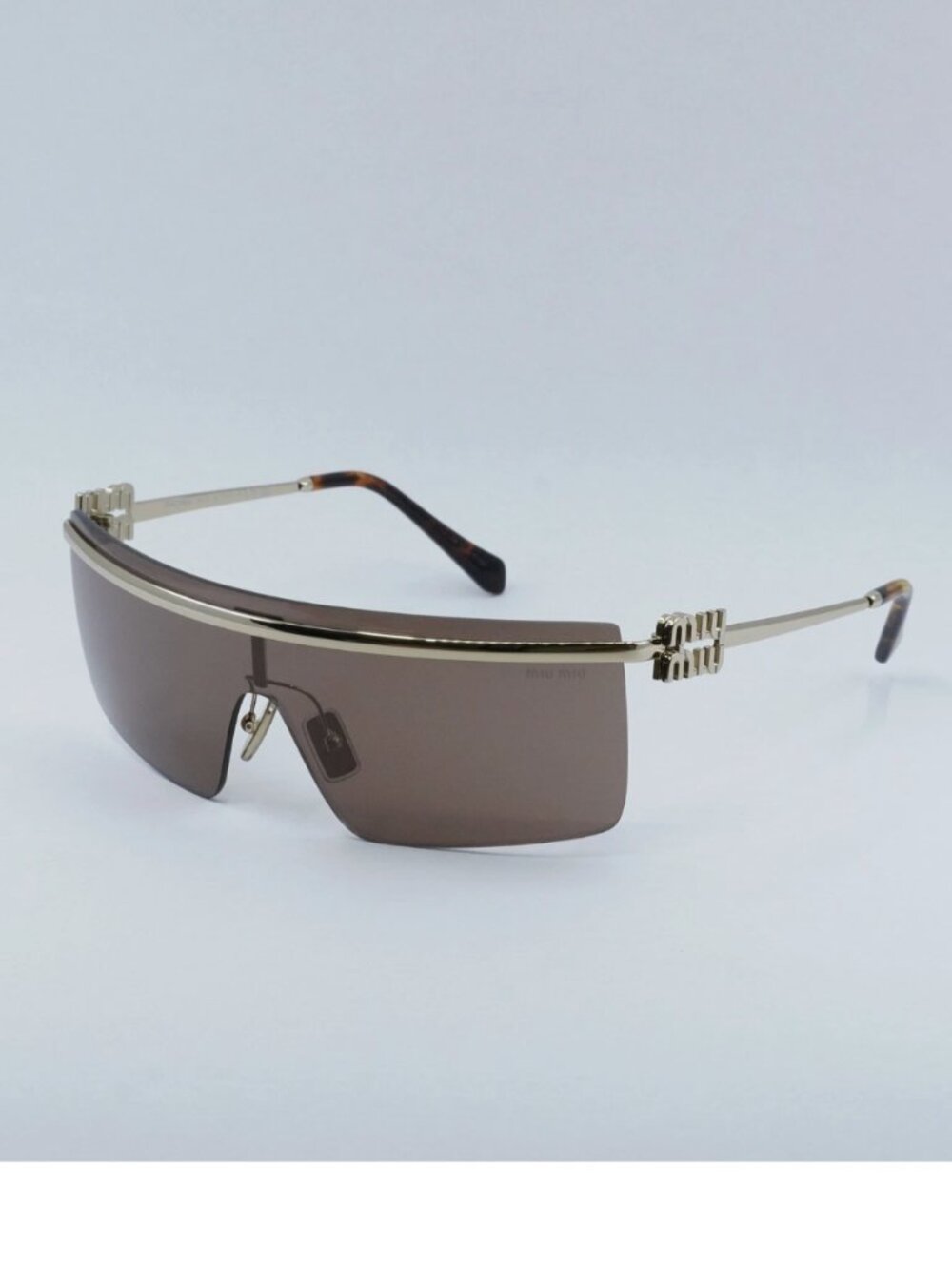 Miu Miu MU50ZS rimless metal shield sunglasses with brown tinted lenses